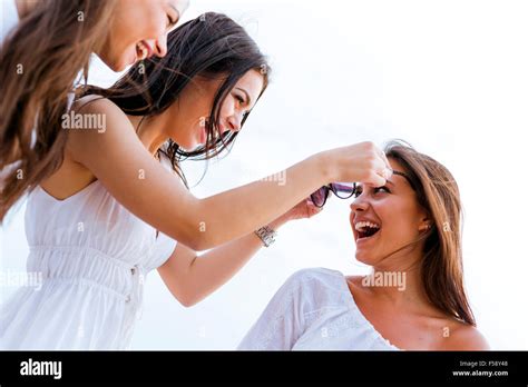 Cheerful women having fun outdoors and laughing happily Stock Photo - Alamy