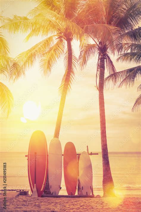 Surfboard and palm tree on beach background. Stock Photo | Adobe Stock