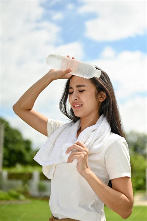 Premium Photo | A sweaty Asian woman feeling hot and tired rests after