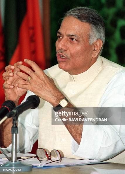 indian finance minister yashwant sinha gestures   addresses
