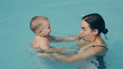 Adult and Baby in the Pool · Free Stock Video