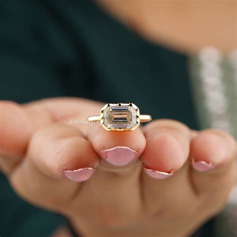 emerald cut east west ring 1