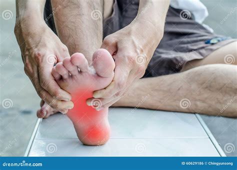 Pain In The Foot. Massage Of Male Feet. Stock Photo - Image: 60629186