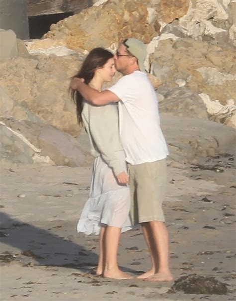 Leonardo DiCaprio appears to comfort Camila Morrone on the beach
