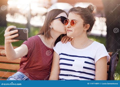 Women Lesbians Enjoy Spare Time in Park, Pose for Making Selfie in