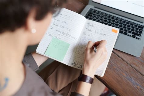 photo  person writing  notepad  stock photo