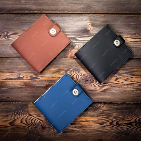 premium photo  leather wallet  rustic wood background