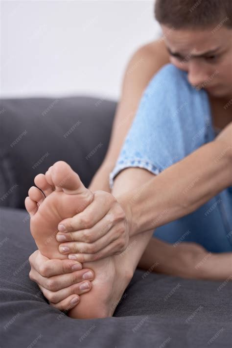 Premium Photo | Woman foot pain and muscle ache in home massage and