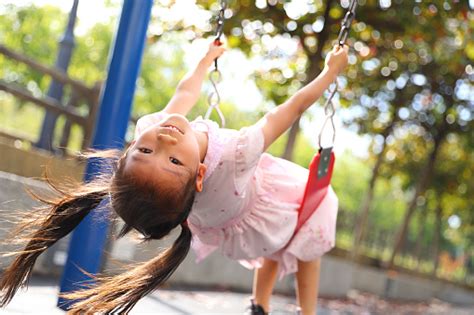 Girls Playing Swing Stock Photo - Download Image Now - 6-7 Years ...