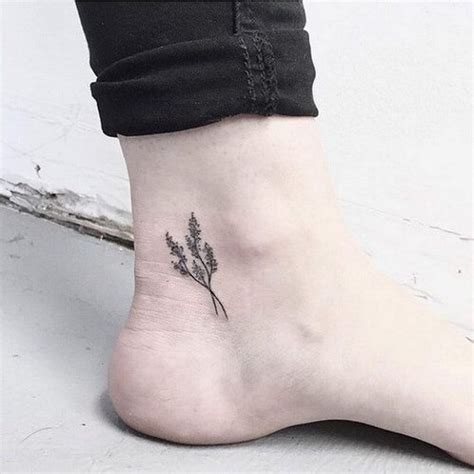 Tiny black flower tattoo - Tattoogrid.net