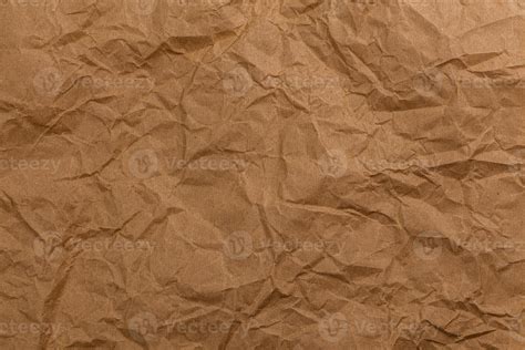 ragged crumpled brown kraft paper texture  full frame background