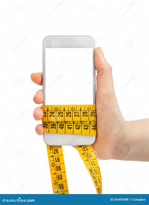 Holding the Smartphone and Measuring Tape Stock Photo - Image of