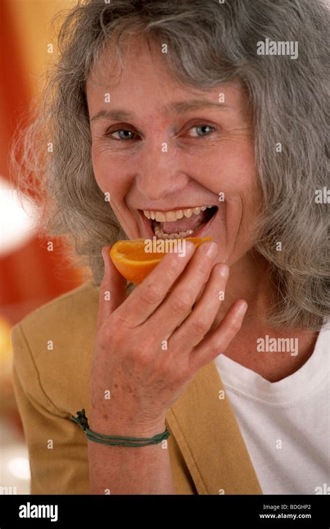 ELDERLY PERSON EATING FRUIT Stock Photo - Alamy