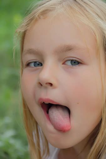 Preschooler With Put Out Tongue Stock Photo - Download Image Now ...