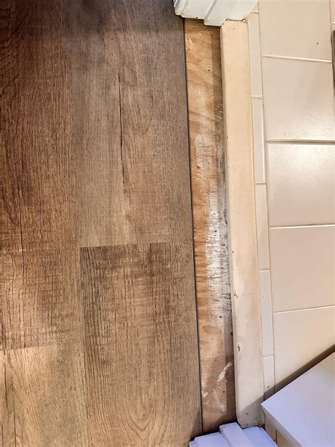 Transition option for this LVP to bathroom tile : r/Flooring