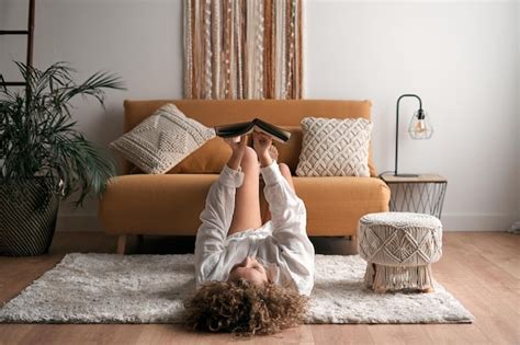 Premium Photo | Woman reading book in living room