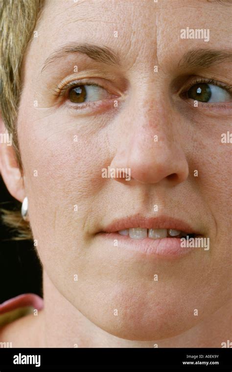 shy woman biting lip  res stock photography  images alamy