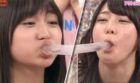 Two girls compete to blow a beetle down the other's throat | Life