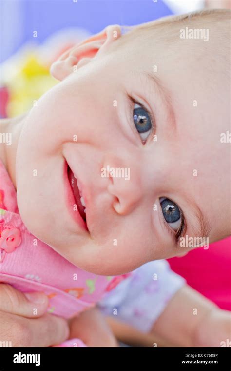 Happy baby girl with blue eyes Stock Photo - Alamy