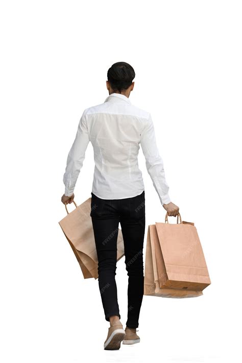 Man on a white background with shoppers back view | Premium Photo