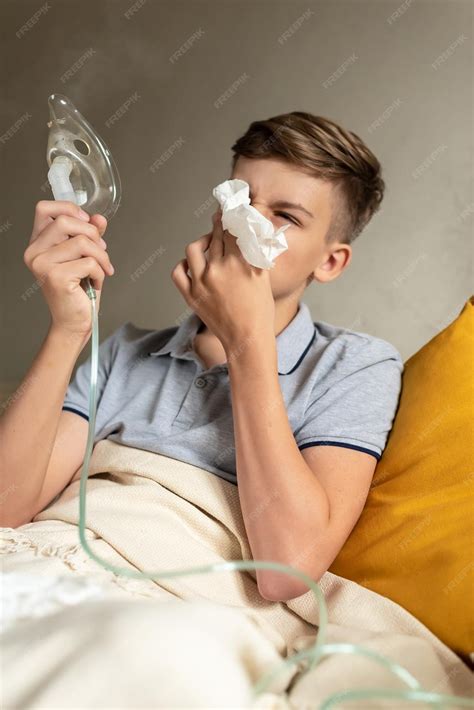 Premium Photo | Sick teen boy with an inhaler unhealthy child doing