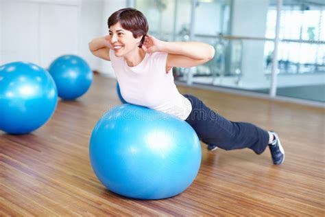 Pilates Exercise. Woman Doing Pilates Ball Exercise and Smiling. Stock ...