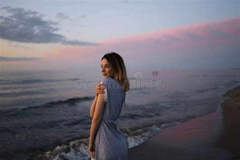 medium shot portrait   beautiful blonde woman   light blue dress