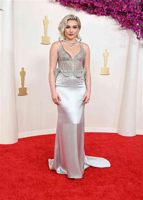 Florence Pugh Wears Wet-Look Dress on the 2024 Oscars Red Carpet | Photos
