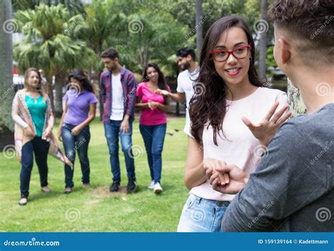 Flirting Couple with Group of Friends Stock Photo - Image of happy, resting: 159139164