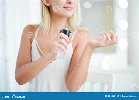Woman spray perfume stock image. Image of femininity - 156360117