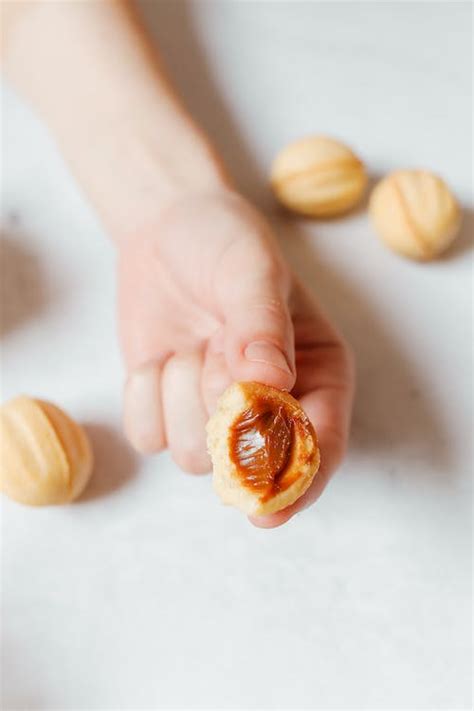A Person Holding an Oreshki · Free Stock Photo