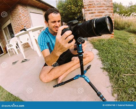 Photographer stock photo. Image of tripod, camera, photographer - 42894748