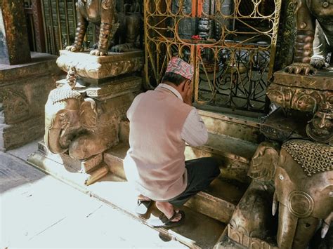 Man Praying at Temple · Free Stock Photo