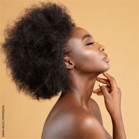 Face Profile of African Beauty Woman massaging Face and Neck. Dark Skin ...