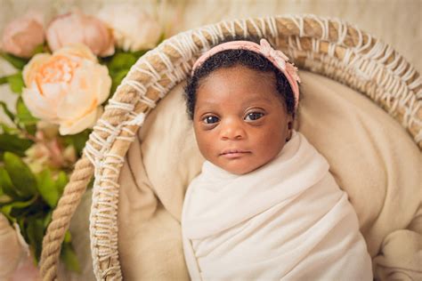 Download A beautiful newborn baby snuggled up in a warm blanket ...