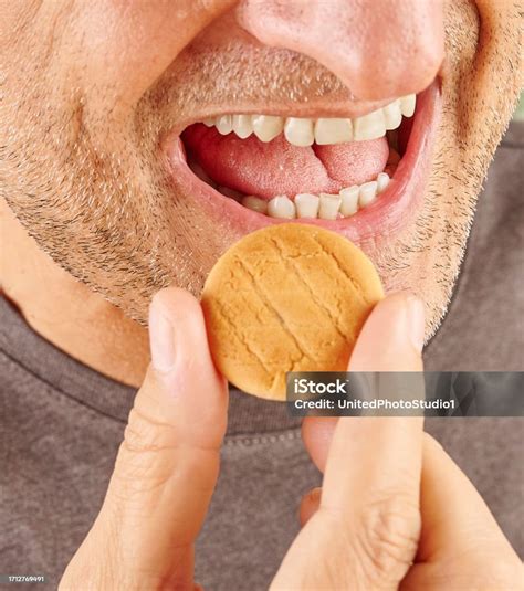 close  mouth  man eating biscuit style stock photo  image