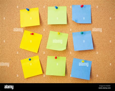 Colour note papers on pin board. Cork background Stock Photo - Alamy