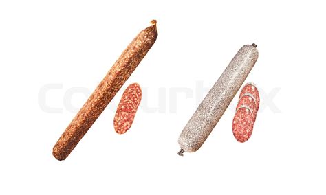 Two salami sticks with slices isolated on white | Stock image | Colourbox