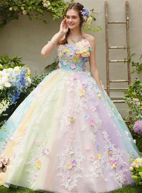 This pastel rainbow gown from Nicole Collection featuring 3D floral appliques is sure to fulfill ...