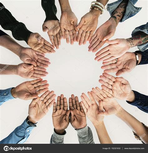 People Holding Hands Together In A Circle