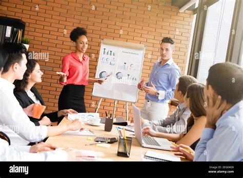 Mixed race business people in meeting room making a presentation Stock ...
