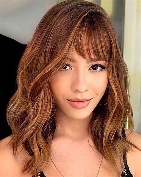 Fashion experts clash over whether short layered hairstyles with bangs trend 22