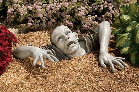 garden zombie statue geekalerts