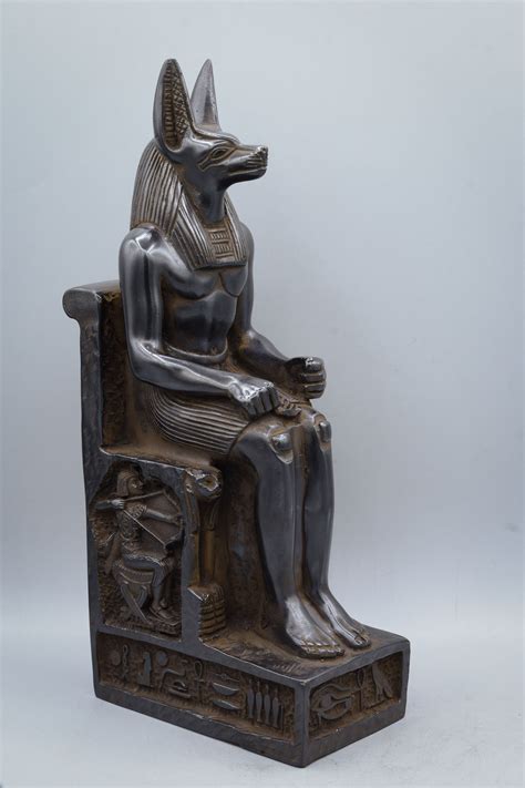 Anubis Stone Statue Anubis Statue At A Theme Park In Daylight · Free