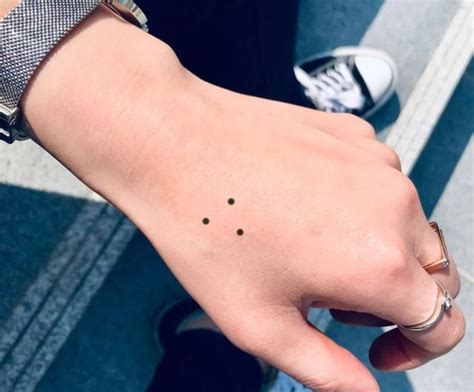 dot triangle tattoo meaning unveiling symbolism  significance