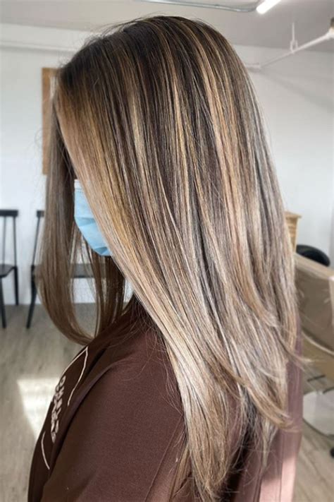 Transform Your Look This Season With Stunning Blonde Highlights On Red Brown Hair For A Sun Kissed Glow 9