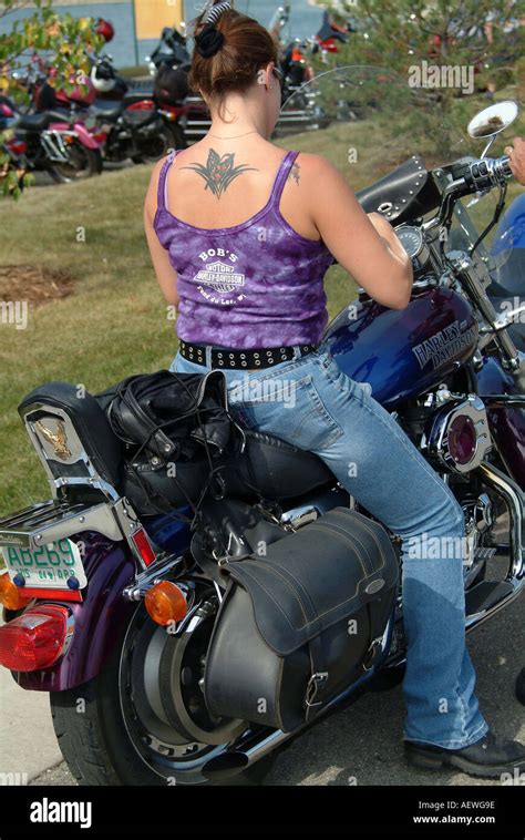 A woman riding Harley Davidson motorcycle Stock Photo - Alamy