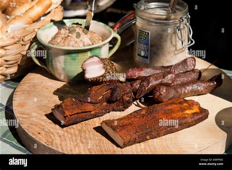 traditional Austrian Jause (snack) with sausages, bacon, lard and ...