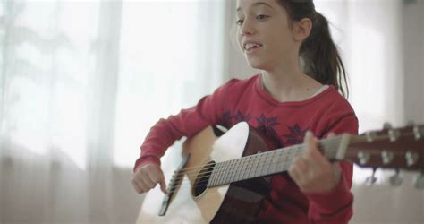 young girl playing guitar and singing Stock Video Footage 00:33 SBV ...