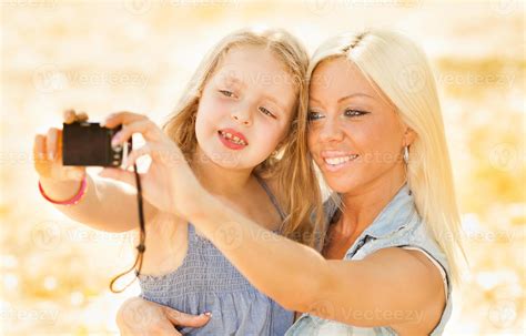 Mother And Daughter Pose For A Selfie 14230643 Stock Photo at Vecteezy